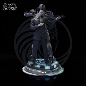 May include: A detailed figure of a man in a pinstripe suit, with a metallic figure behind him. The figure is standing on a circular platform with blue accents. The text "Jansen Figures" is in the upper left corner.