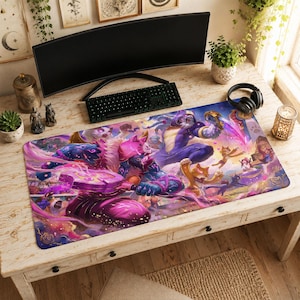 May include: A rectangular desk mat featuring a vibrant, colorful fantasy illustration of anthropomorphic cat warriors in purple and pink armor. The artwork depicts multiple feline characters in dynamic poses with glowing magical weapons and effects.