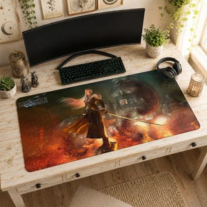 May include: A rectangular gaming mouse pad featuring a Final Fantasy character with long silver hair, holding a sword, set against a fiery background. The pad is on a wooden desk with a keyboard, monitor, and headphones.