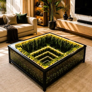 May include: A modern living room with a beige sofa, green accent pillows, and a unique coffee table. The coffee table features a glass top with a green plant display and illuminated edges. A large TV is mounted on the wall.