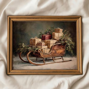 May include: A framed oil painting depicting a wooden sleigh filled with stacked gift boxes wrapped in brown paper and one red box, accented with green pine branches and pinecones, set against a dark, moody background with a snowy ground.