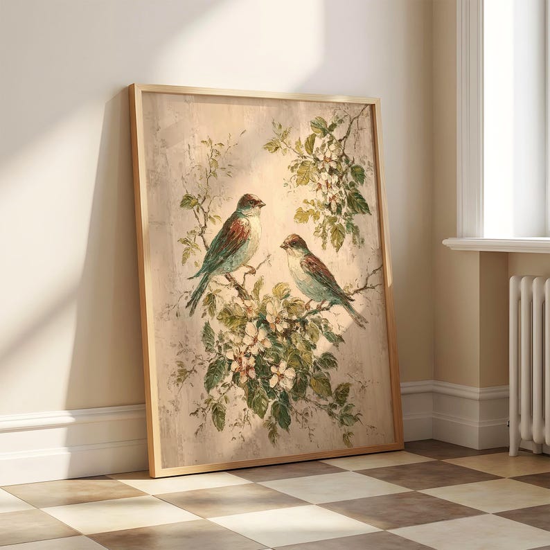 May include: A rectangular framed wall art print featuring a painting of two birds perched on flowering branches. The birds have blue and brown plumage, and the flowers are white with green leaves, all set against a textured, light beige background.