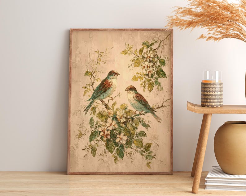 May include: A rectangular wall art print featuring a painting of two birds perched on flowering branches. The birds have brown and blue-green plumage, and the blossoms are white with green leaves. The background is a textured, light beige colour.