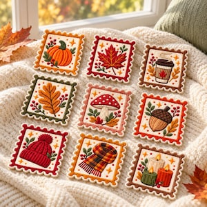 May include: A set of nine square embroidered patches with scalloped edges, featuring autumn-themed designs including a pumpkin, maple leaf, coffee cup, oak leaf, mushroom, acorn, knit hat, plaid scarf, and two candles with flames.