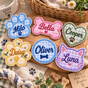May include: Six embroidered fabric patches featuring gingham patterns and personalized names. Shapes include a blue paw print with Milo, a pink bone with Bella, a green heart with Cooper, a yellow flower with Daisy, a blue circle with Oliver, and a purple cat face with Luna.