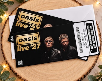 Puede incluir: Una entrada de concierto negra para Oasis Live '27 con un logotipo dorado, una fotografía de dos hombres y un código de barras. El texto dice: London O2 Arena, 26th June 2027, y Amy you're going to see Oasis! Love from Mum & Dad x. Incluye un código QR.