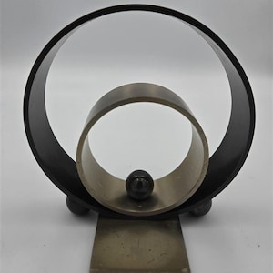 1933 Art Deco Ring Bookend by Walter von Nessen | Machine Age Sculpture (Chase Brass)