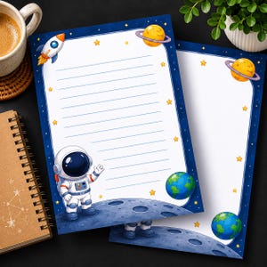 May include: Two sheets of space-themed stationery. Each sheet has a blue border with stars, a rocket, planets, and an astronaut. The lined paper is white. The astronaut is waving. The stationery is designed for kids.