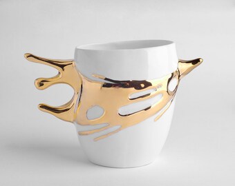 Porcelain Mug with a splash of gold. Dynamic shape mug for a tea or coffee lover. The Splash Collection.