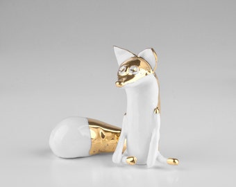 Porcelain golden fox figurine