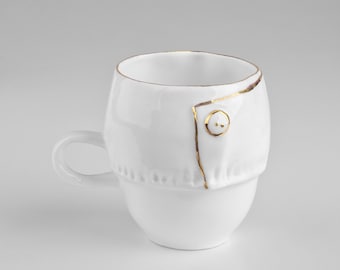 Porcelain small cup with a gold button for a coffee and fashion lovers. Chic Collection.
