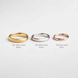 May include: Three wedding bands in different finishes: 18K Yellow Gold Matte, 18K White Gold Matte, and 18K Rose Gold Shiny.