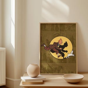 May include: A framed rectangular print featuring a comic book illustration of a character with orange hair in a brown suit running alongside a white dog. The central image is set against a yellow circle, layered over a muted olive comic strip background.