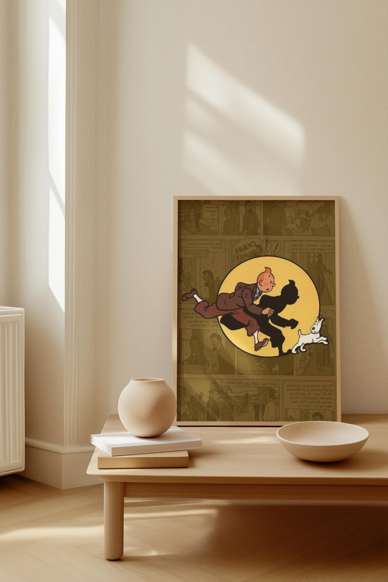 May include: A framed rectangular print featuring a comic book illustration of a character with orange hair in a brown suit running alongside a white dog. The central image is set against a yellow circle, layered over a muted olive comic strip background.