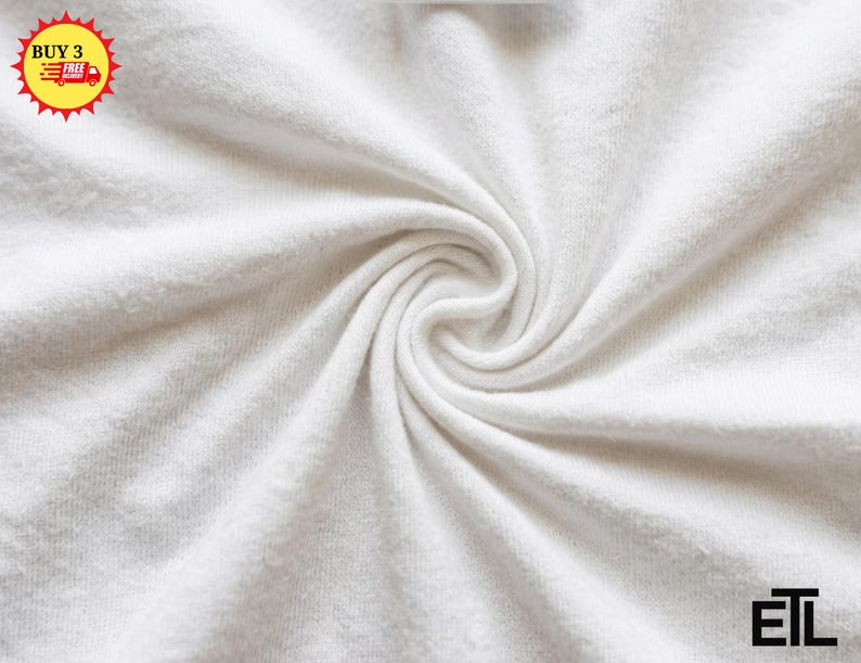 May include: A solid white fabric with a soft, textured surface arranged in a central spiral swirl pattern. In the top left corner, a yellow circular badge displays the text BUY 3 FREE DELIVERY. The bottom right corner features the black text ETL.
