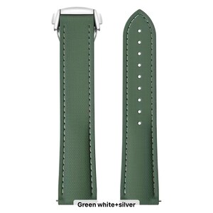 May include: A green watch strap with white stitching and a silver clasp. The strap is made of a textured material and has a classic design. The text "Green white+silver" is at the bottom of the image.