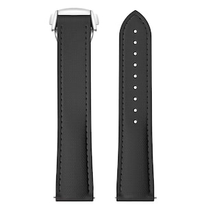 May include: A black watch strap with a textured surface and white metal clasp. The strap has a series of holes for adjustment and is designed to attach to a watch face. The strap is shown against a white background.