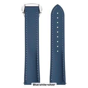 May include: Two-piece watch strap in a deep blue color with white stitching. The strap has a textured surface and a silver-colored clasp. The text "Blue white+silver" is at the bottom of the image.