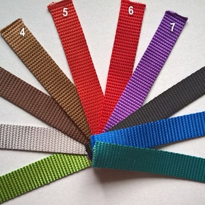 May include: Ten different colours of webbing, each with a number from 1 to 10. The webbing is arranged in a fan shape, with the colours ranging from green to teal to blue to black to purple to red to brown to grey to brown to gold.