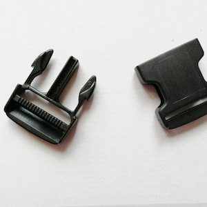 May include: Two black plastic buckles, one with a side release and one with a standard buckle.