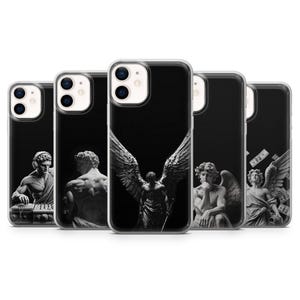May include: Five clear phone cases featuring black and white classical statue designs. The designs include a statue with headphones at a DJ deck, a back view of a statue, a winged angel with a sword, a pensive statue, and an angel with floating dollar bills.