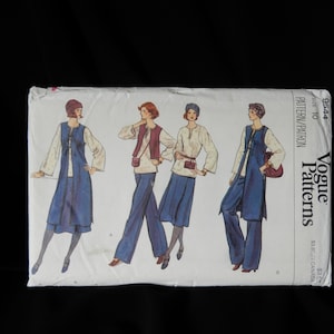 May include: Vogue Patterns sewing pattern envelope with four different outfit designs. The designs feature a long blue skirt, a vest, and pants. The pattern number is 9544.