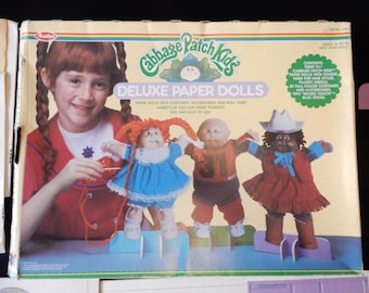 Cabbage Patch Kids Deluxe Paper Dolls, 9.5" tall, 2 largely complete, opened sets, cardboard dolls, stands, stick on clothes, retro 1983