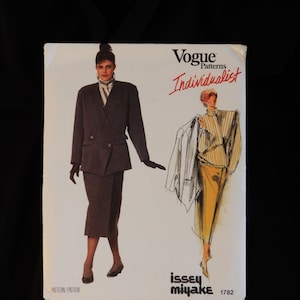 Size 12, Vogue 1782 Issey Miyake collarless jacket with belt, tab, pocket trim, high collar wrap shirt, straight wrap skirt, 1986, uncut