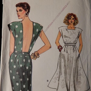 May include: A sewing pattern for two dresses. The dress on the left is green with white polka dots and a low back. The dress on the right is white with a square neckline and a full skirt. The pattern is for sizes 8-10-12.