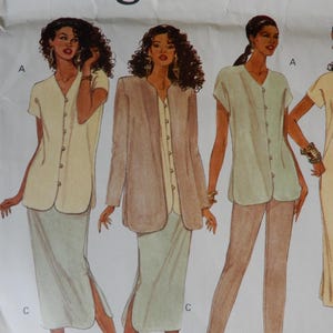 May include: Vogue pattern featuring illustrations of women's clothing designs. The designs include button-down tops, skirts with side slits, and a long jacket. The color palette consists of neutral tones like beige, light green, and brown. The Vogue logo is visible at the top.