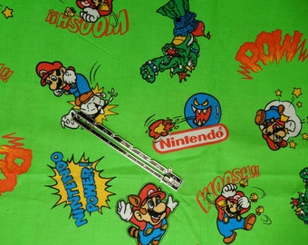 Nintendo fabric, copyrighted by Cranston Print Works Company, Millworth Fabrics USA, quilting cotton, 1 yard long, 61" wide, new, lime green