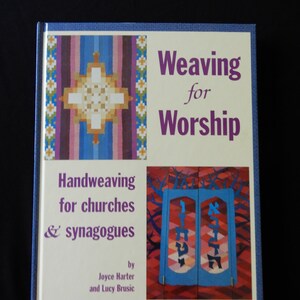 May include: A hardcover book titled "Weaving for Worship" with a blue border. The cover features colorful woven designs and the text "Handweaving for churches & synagogues" and the names Joyce Harter and Lucy Brusic.