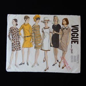May include: A vintage Vogue sewing pattern for a basic dress, pattern number 1849. The pattern shows six different women wearing the dress in various colors and patterns. The text "Vogue's Basic Dress" and "Patterns are NOT actual size" is printed on the pattern.