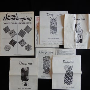 May include: A collection of vintage knitting patterns and a Good Housekeeping magazine cover. The magazine cover reads "Marvelous Pillows to Make." The patterns include designs for afghans, squares, and a jacket. The patterns are printed in black ink on white paper.