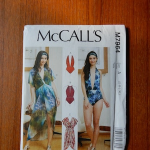 May include: A sewing pattern for a swimsuit and a dress. The pattern is from McCall's and the pattern number is M7964. The pattern includes sizes S, M, L, and XL.