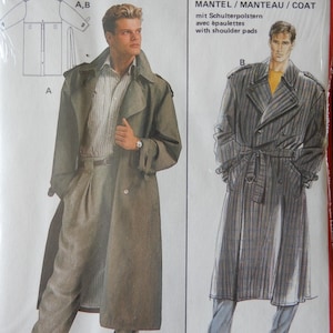 May include: A vintage sewing pattern for a coat with shoulder pads. The pattern features a man modeling a long, olive-green trench coat and matching trousers. The text includes size measurements in inches and centimeters.