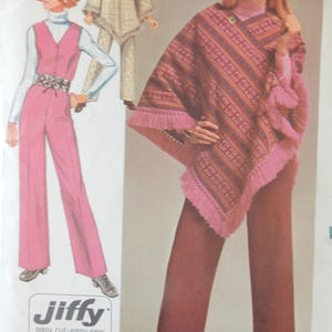 May include: Vintage sewing pattern featuring a woman in a pink and brown poncho with fringe, and brown pants. The pattern also shows a pink jumpsuit and a beige poncho. The Jiffy pattern is for easy cut and easy sew.