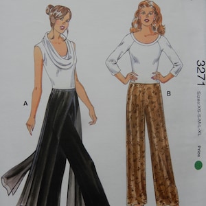 May include: A sewing pattern featuring two women's fashion designs. One design includes a white cowl-neck top with black palazzo pants. The other design features a white long-sleeve top and brown floral print palazzo pants. The pattern includes sizes XS-XL.