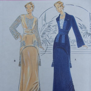 May include: A sewing pattern envelope titled Retro Fashion Collection featuring illustrations of two floor-length dresses. Dress B is light tan with lace sleeves and floral embroidery. Dress A is dark blue with a contrasting bodice and tassels.