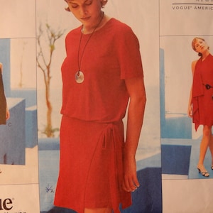 May include: A fashion illustration featuring three women in red and black dresses. The dresses include a wrap dress, a sleeveless dress, and a dress with a scarf-like element. The Vogue logo is visible in the bottom left corner.