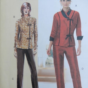 May include: A sewing pattern envelope featuring illustrations of two outfits. One shows a tan leopard print jacket with dark closures and dark trousers. The other shows a solid red jacket with black trim and ties, paired with matching red trousers.