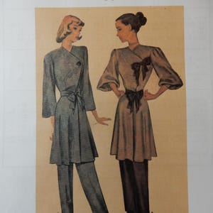 May include: Illustration of two women modeling vintage loungewear. One wears a gray wrap top and pants, the other a tan wrap top and black pants. The image includes text: EvaDress Patterns, EvaDress.com, NL40-6593, 1946 Lounging Ensemble.