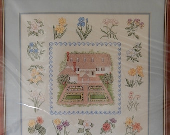 Reflections of Williamsburg, counted cross stitch kit, NIP, finishes to 14" square, ivory Aida, house with garden, border of various flowers