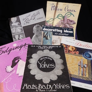 May include: A collection of vintage crochet pattern books, including titles like "Pillow Cases," "Edgings," and "Hats Baby Yokes." The books feature illustrations of crochet projects and text. The color palette includes pink, black, white, and yellow.