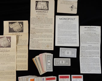 Vintage Monopoly lot, 83 Title Deed cards, stack of smaller vintage Monopoly money plus directions dated 1935 - 1973, Monopoly collectors