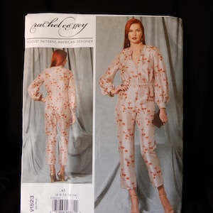 May include: A sewing pattern for a jumpsuit with long sleeves and a V-neckline. The pattern is by Rachel Comey and is for sizes 6-8-10-12-14. The pattern is printed on a white background with a black border.