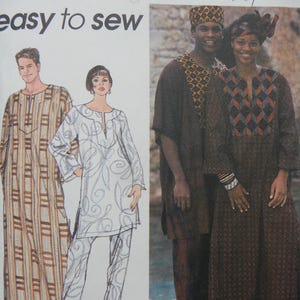 May include: Simplicity sewing pattern featuring various ethnic-inspired clothing designs. The patterns include tunic tops, pants, and long dresses with geometric and patterned details. The image shows models wearing the finished garments, showcasing the style and fit.