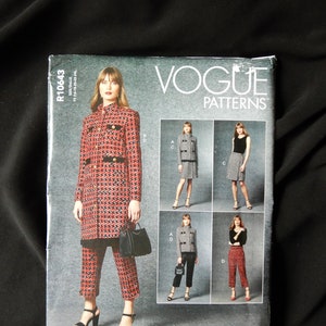 May include: Vogue Patterns sewing pattern for a jacket and pants. The pattern shows four different styles of the jacket and pants. The jacket is a black and white houndstooth pattern with red accents. The pants are a cropped style. The pattern number is R10643.