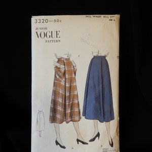 May include: Vintage Junior Vogue sewing pattern number 3320-50c for a skirt. The pattern includes instructions for two different styles of skirts, one plaid and one solid.