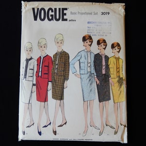 May include: A vintage Vogue sewing pattern for a basic proportioned suit. The pattern number is 3019. The pattern shows five different women wearing the suit in various colors and patterns. The text on the pattern reads "Basic Proportioned Suit 3019, Vogue pattern, Short, Average and Tall Figure Heights."